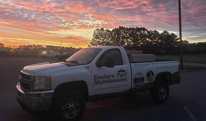 E.T.M. truck in a setting sun.